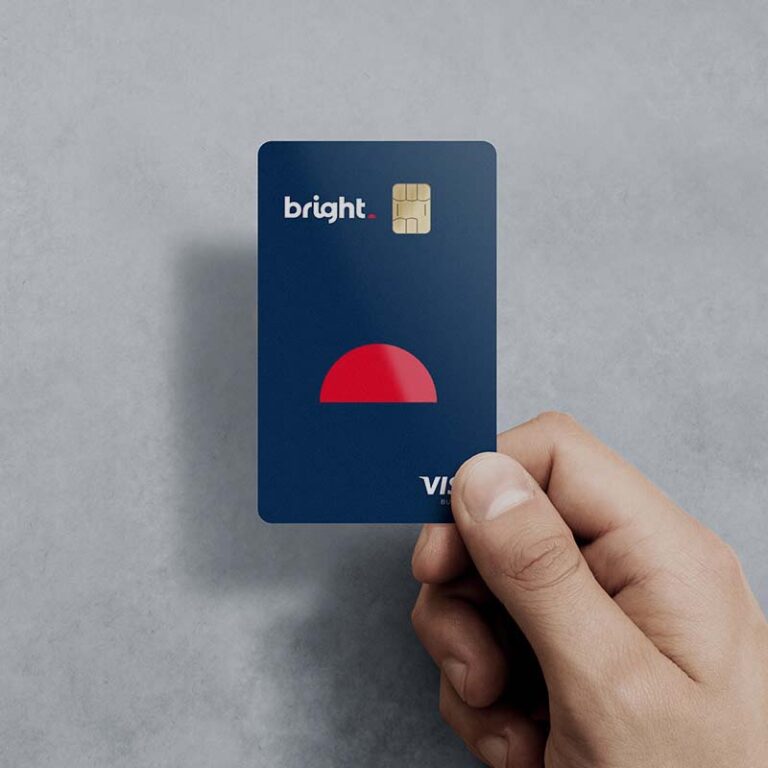 photo of a hand holding a bright bank Visa card