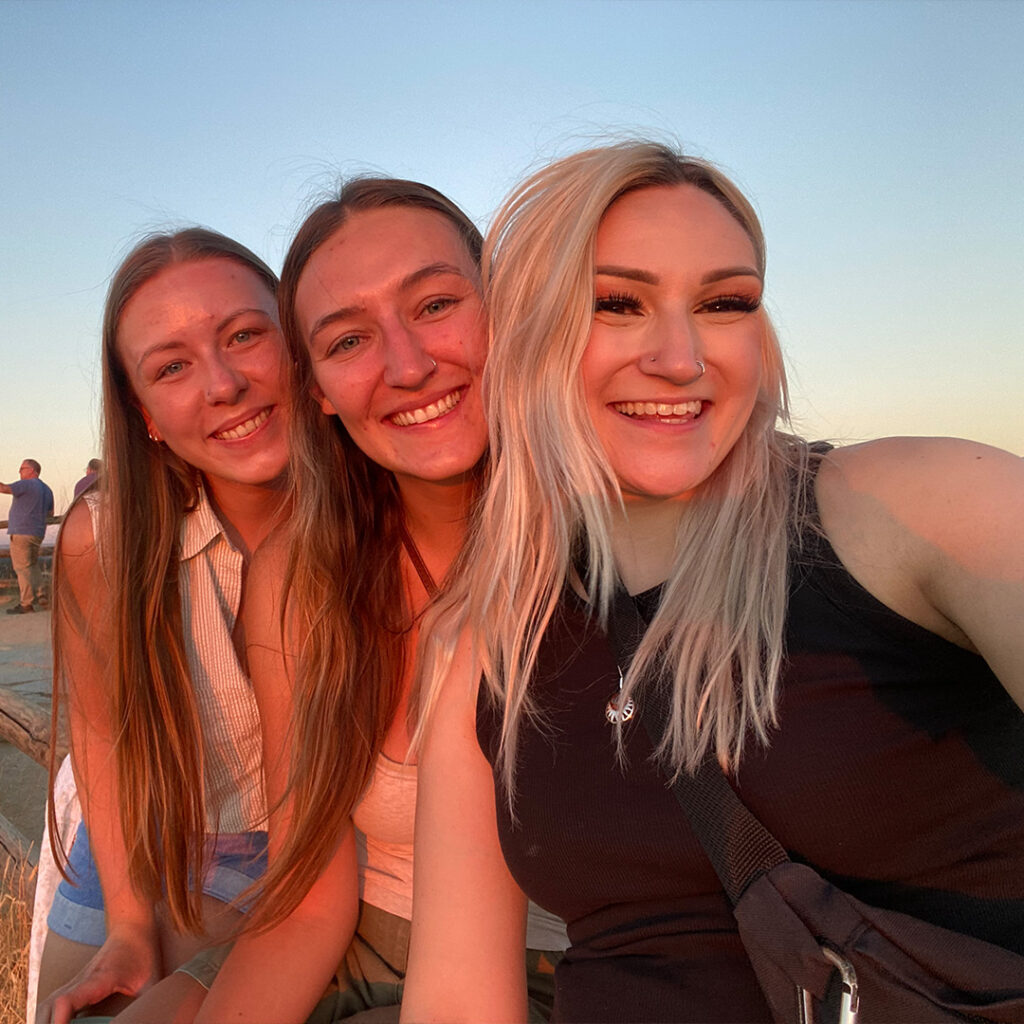 Lizzie smiling with friends