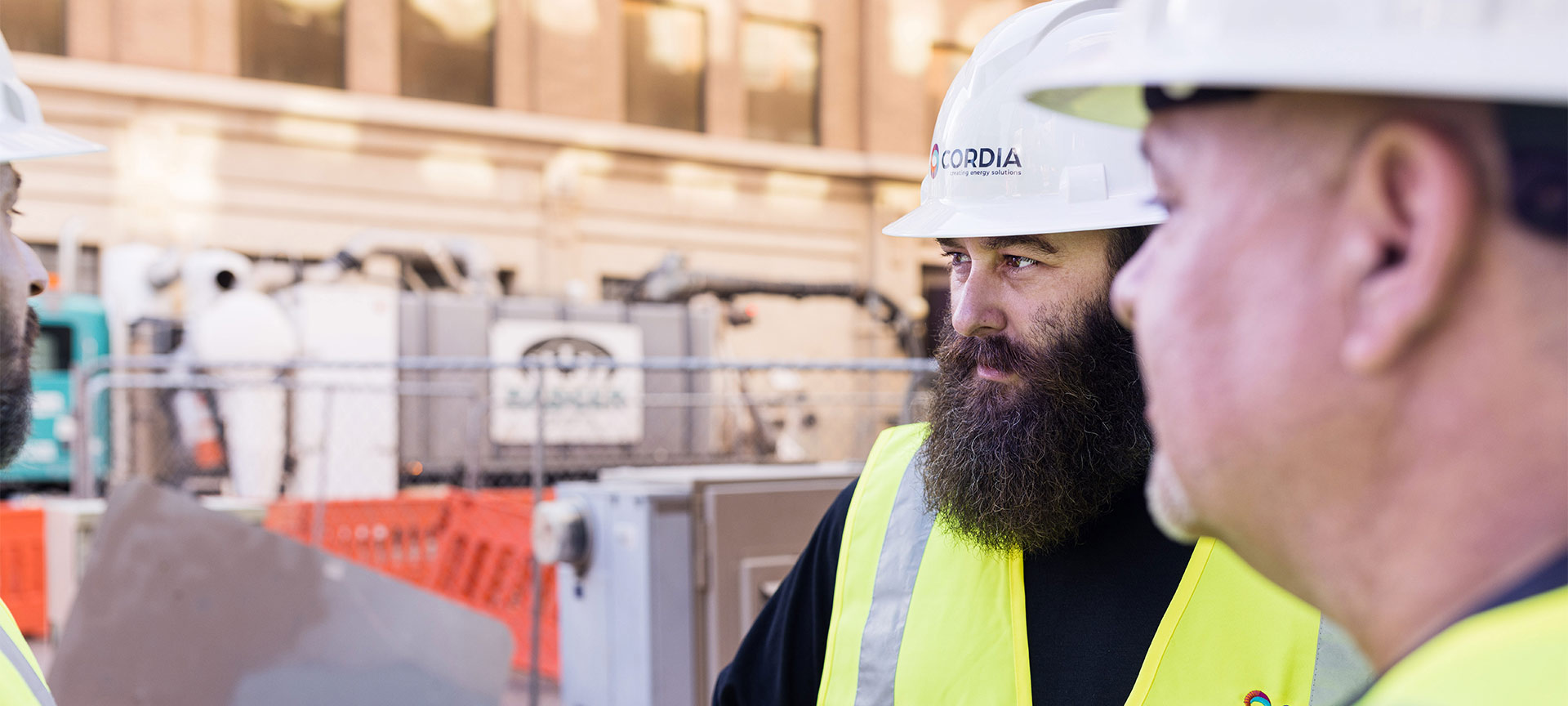 Cordia employees gathered at a work site having a conversation.