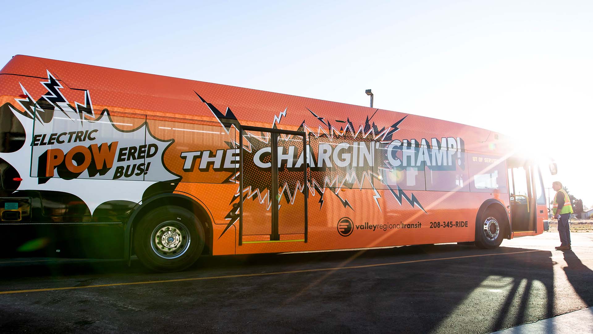 Electric bus wrapped with bold graphics for electric bus launch