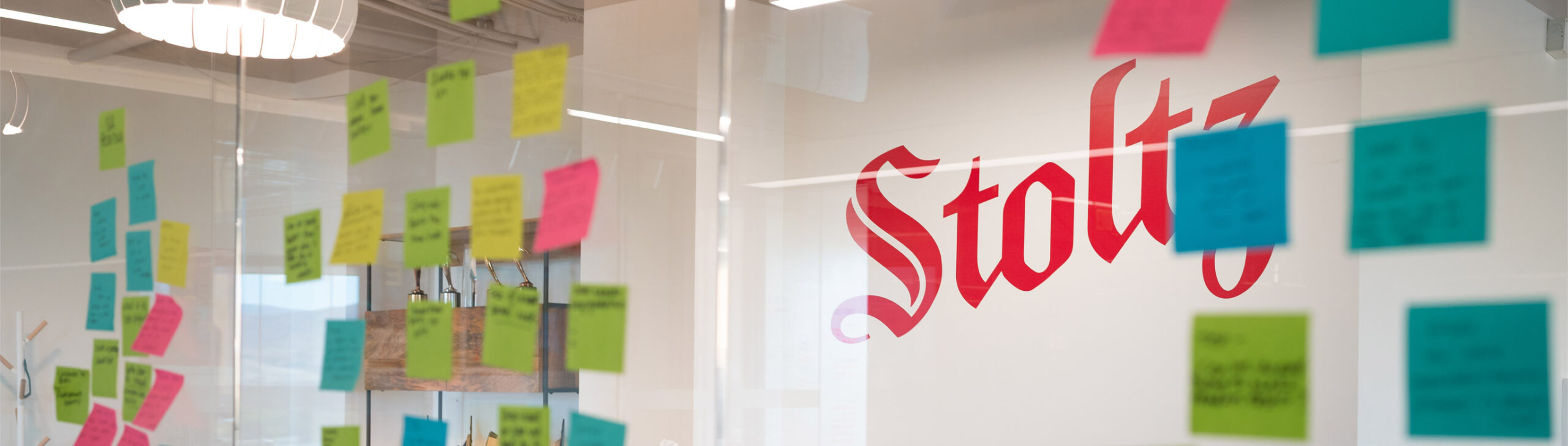 Stoltz Marketing Group conference room with assorted sticky notes on the windows