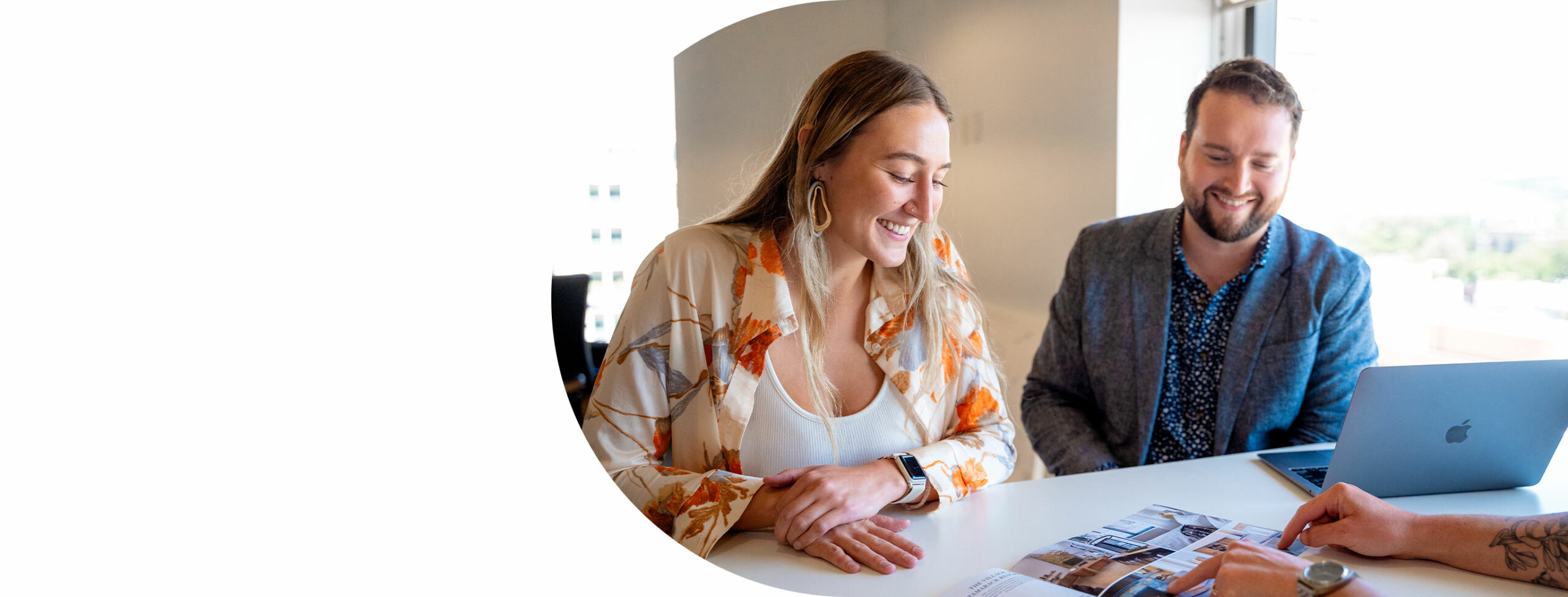 photograph of collaborating Stoltz Marketing Group employees