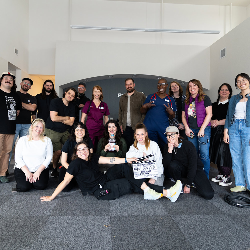 Large production crew poses together after wrapping a Primary Health campaign shoot.