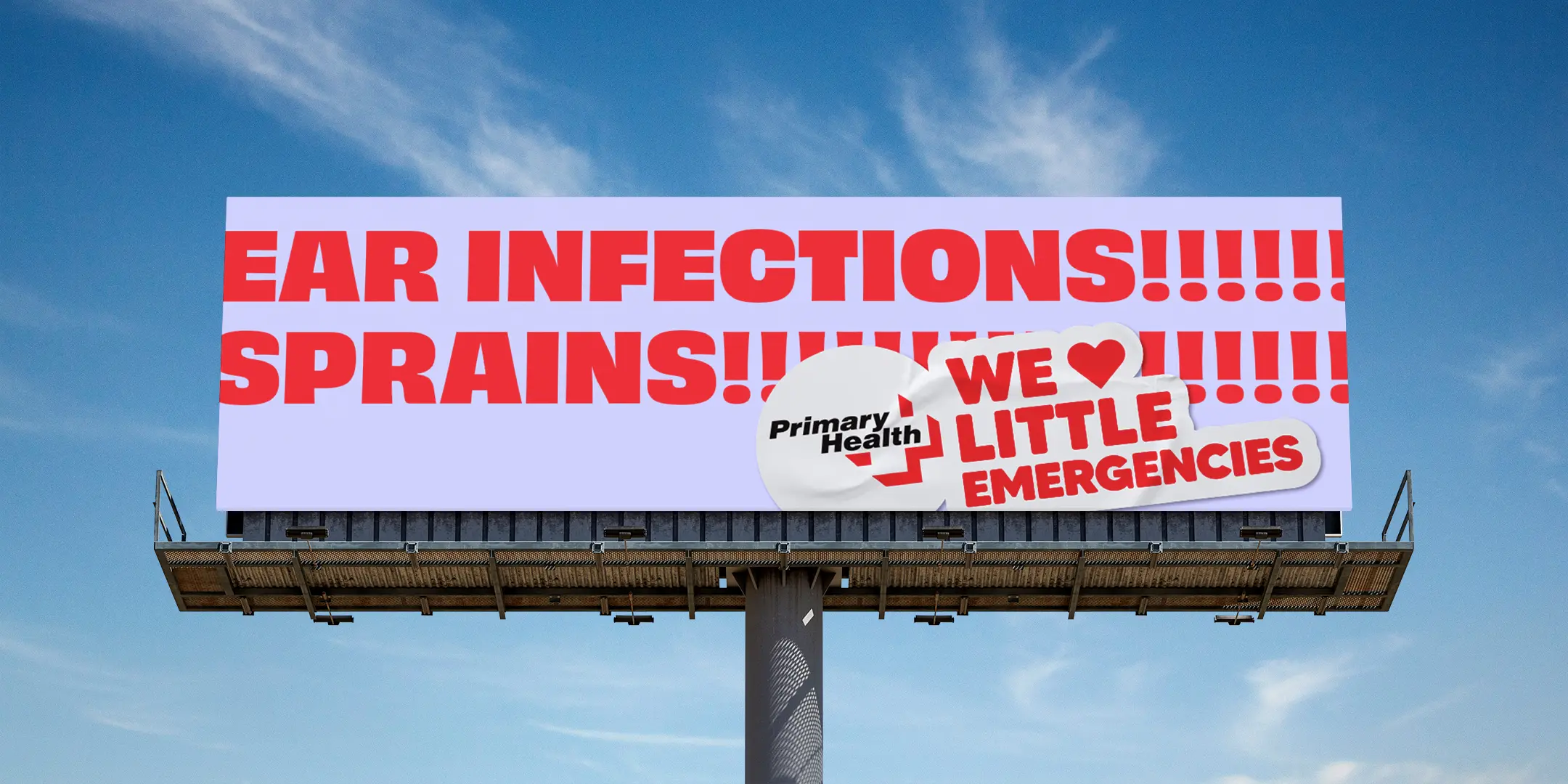 Primary Health billboard with large red text reading ‘Ear infections! Sprains!’ against a blue sky.