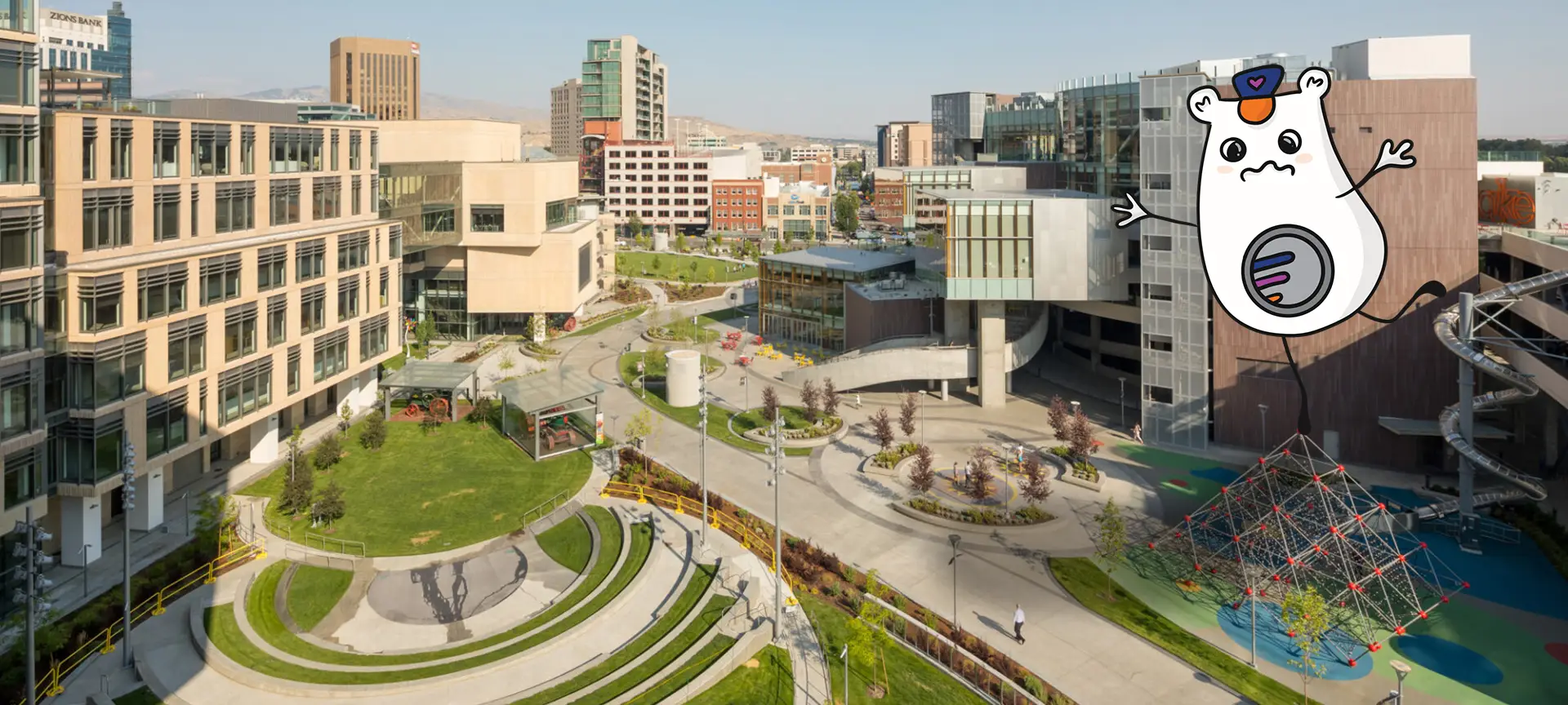 Image of JUMP and Simplot campus in Boise with Lil Rider balancing on a pyramid jungle gym